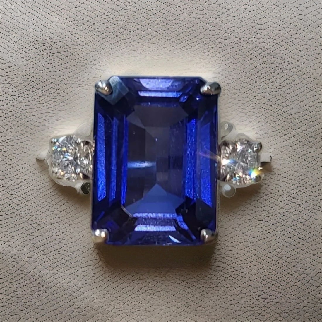 14K WHITE GOLD ENGAGEMENT RING 11.05CT. GEM BLUE SAPPHIRE EMERALD SHAPE: 14K WHITE GOLD ENGAGEMENT RING 11.05CT. GEM BLUE SAPPHIRE EMERALD SHAPE Gorgeous 14k white gold engagement ring blue sapphire in an emerald shape Center lab-grown sapphire weight 11.05ct. size 14x10.3