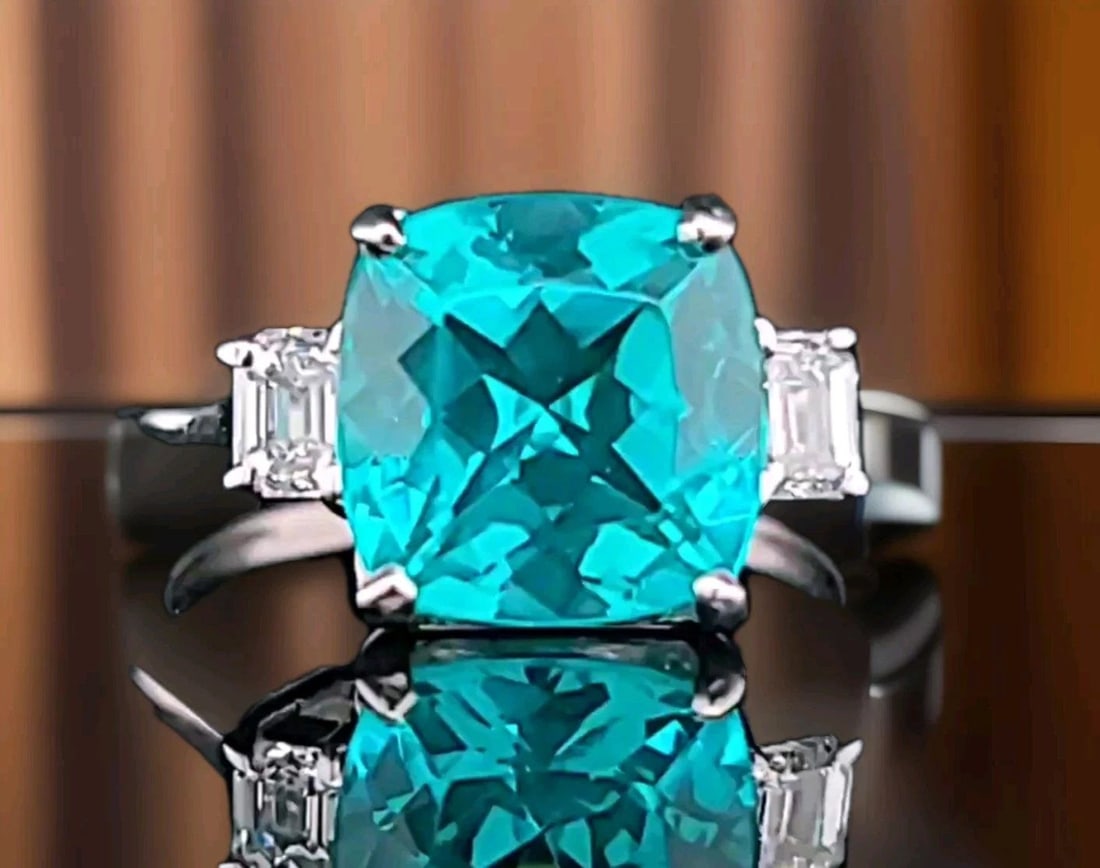 14K WHITE GOLD ENGAGEMENT RING 4.75CT. LAB-GROWN PARAIBA TOURMALINE CUSHION CUT: This stunning 14k white gold ring is the perfect choice for any special occasion, from engagements to birthdays. The ring features a 4.75CT blue Caribbean tourmaline gemstone, lab-grown and cushion cu