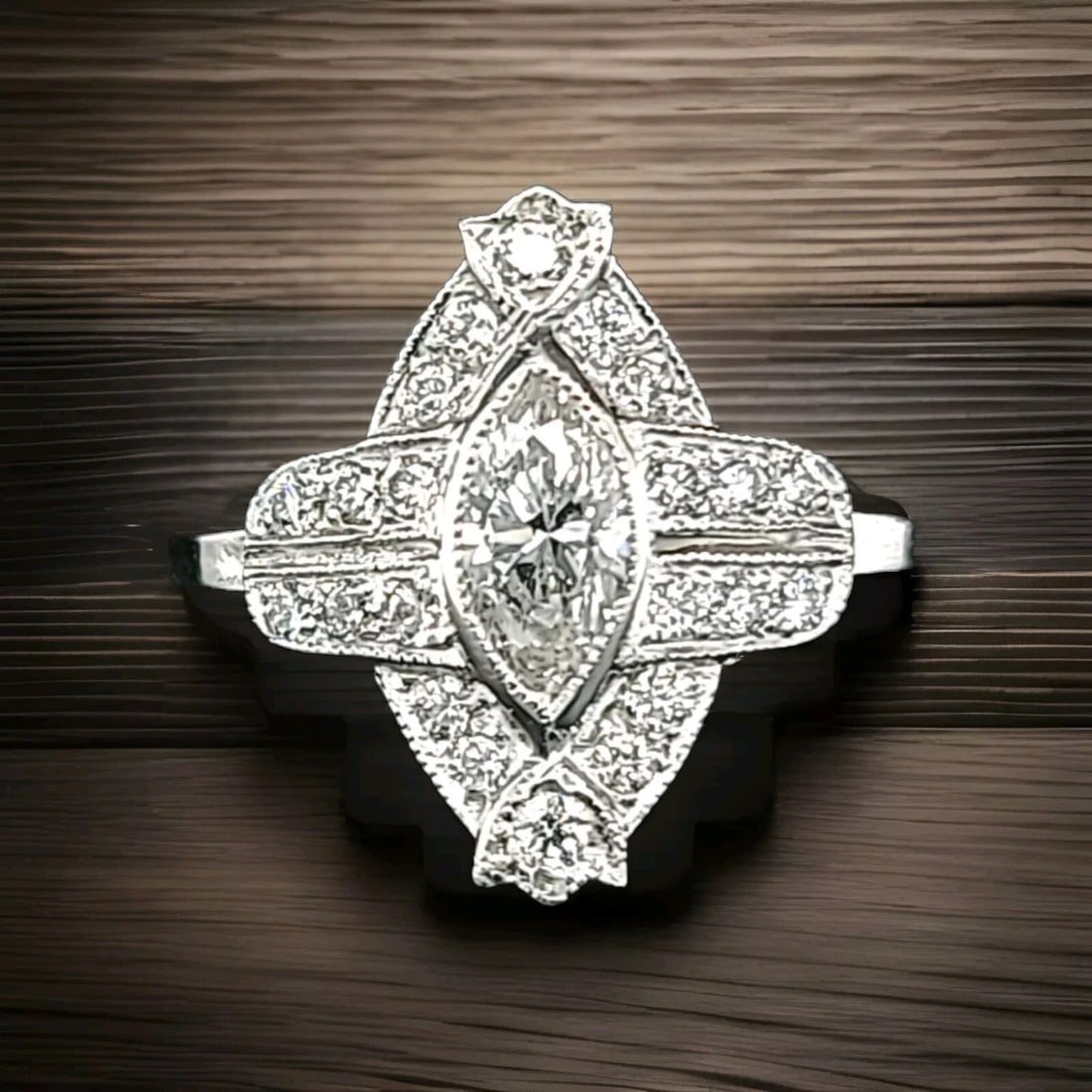 VINTAGE FILIGREE PLATINUM RING NATURAL 0.93CT. MARQUISE DIAMOND SI2-H: 0.93CT VINTAGE FILIGREE PLATINUM RING NATURAL MARQUISE DIAMOND SI2-H Elevate your jewelry collection with this exquisite vintage filigree ring, featuring a natural marquise diamond with a SI2-H grade.