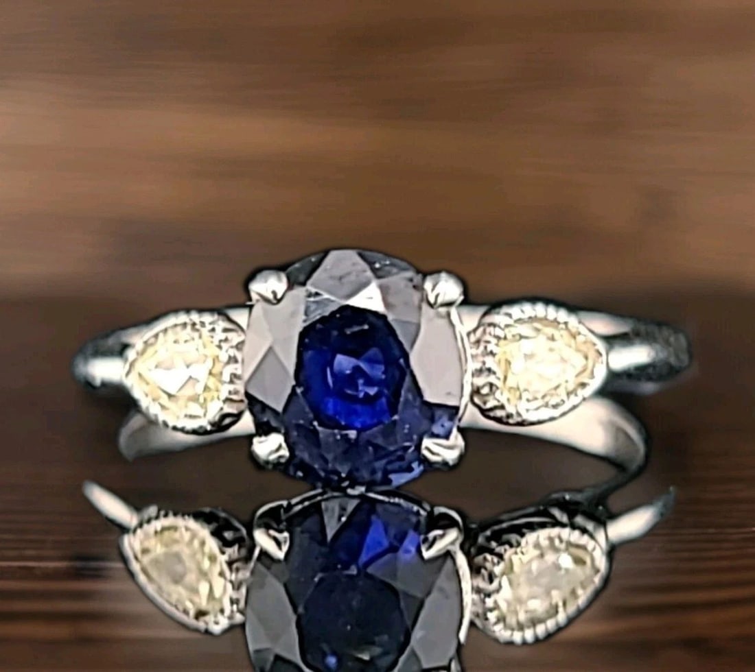 VINTAGE 14K WHITE GOLD ENGAGEMENT RING1.99CT.NATURAL BLUE OVAL SAPPHIRE GIA CERT: VINTAGE 14K WHITE GOLD ENGAGEMENT RING 1.99CT. NATURAL BLUE SAPPHIRE GIA CERT This exquisite 14k white gold engagement ring features a stunning 1.99ct natural blue sapphire, certified by GIA. The oval