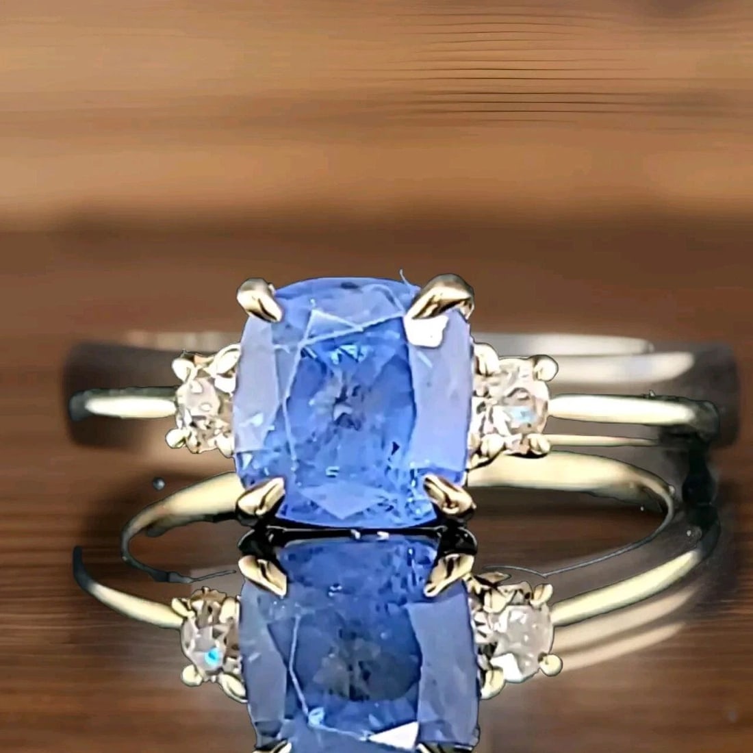 VINTAGE 14K YELLOW GOLD ENGAGEMENT RING 2.18CT.NATURAL BLUE SAPPHIRE CUSHION CUT: VINTAGE 14K YELLOW GOLD ENGAGEMENT RING 2.18CT.NATURAL BLUE SAPPHIRE CUSHION CUT This vintage 14K yellow gold engagement ring features a beautiful cushion-shaped blue sapphire stone, with a total cara