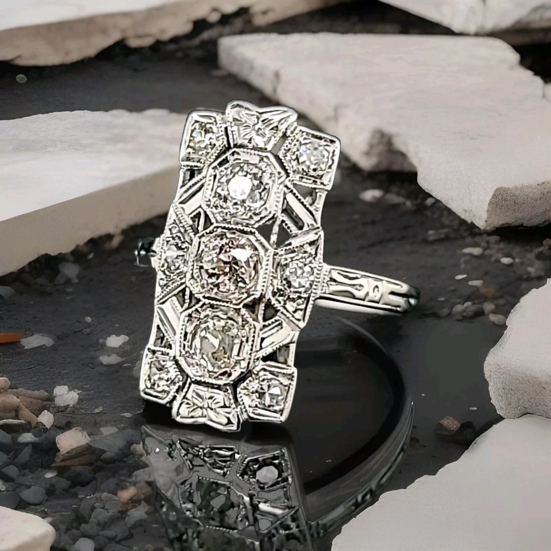 14K WHITE GOLD ART DECO FILIGREE NATURAL EURO ROUND DIAMOND RING 0.57CT. 1930'S: 14K WHITE GOLD ART DECO FILIGREE NATURAL EURO ROUND DIAMOND RING 0.57CT. 1930'S Add a touch of vintage glamour to your style with this stunning 14k white gold cocktail ring. The art deco filigree desi