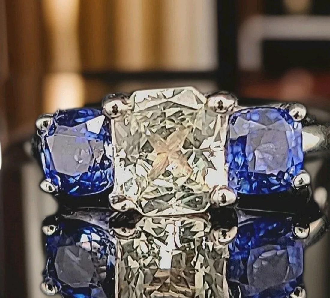 14K WHITE GOLD ENGAGEMENT RING 1.70CT. NATURAL WHITE SAPPHIRE RADIANT CUT: 14K WHITE GOLD ENGAGEMENT RING 1.70CT. NATURAL WHITE SAPPHIRE RADIANT CUT GORGEOUS 14K white gold natural white sapphire ring center natural white sapphire in radiant shape weight 1.70ct. size 7x7.4mm