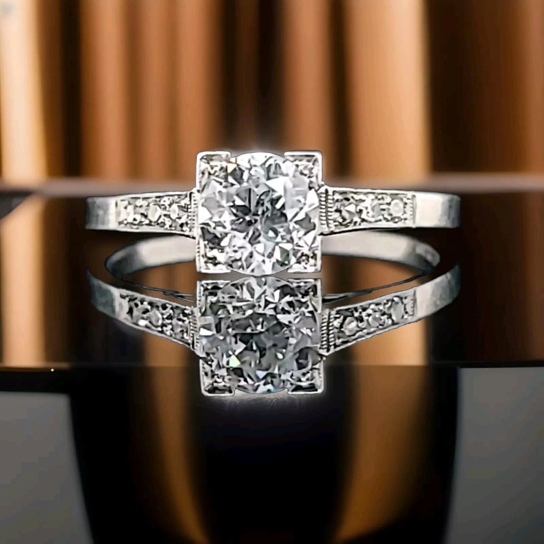 PLATINUM VINTAGE FILIGREE ENGAGEMENT RING 0.78CT. NATURAL EURO CUT ROUND DIAMOND: PLATINUM VINTAGE FILIGREE ENGAGEMENT RING 0.78CT. NATURAL EURO CUT ROUND DIAMOND This stunning platinum engagement ring showcases a natural, round diamond with a Euro cut and a total carat weight of 0