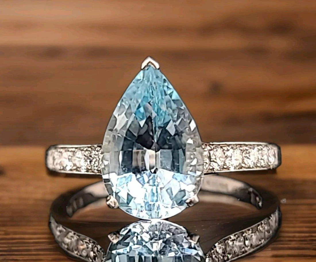 PLATINUM VINTAGE 3.24CT. NATURAL BLUE SKY AQUAMARINE PEAR SHAPE ENGAGEMENT RING: PLATINUM VINTAGE 3.24CT. NATURAL BLUE SKY AQUAMARINE PEAR SHAPE ENGAGEMENT RING GORGEOUS platinum natural aquamarine ring center natural aquamarine pear shape weight 3.24ct. size 11x8mm very lively ,v