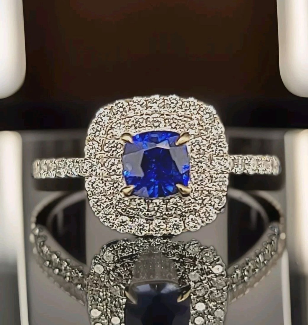 18K WHITE GOLD ENGAGEMENT RING 1.37CT. NATURAL SAPPHIRE CUSHION SHAPE: 18K WHITE GOLD ENGAGEMENT RING 1.37CT. NATURAL SAPPHIRE CUSHION SHAPE GORGEOUS 18K WHITE GOLD natural heated blue Sapphire cushion shape center weight 0.85ct. size 5mm very nice rich royal blue color