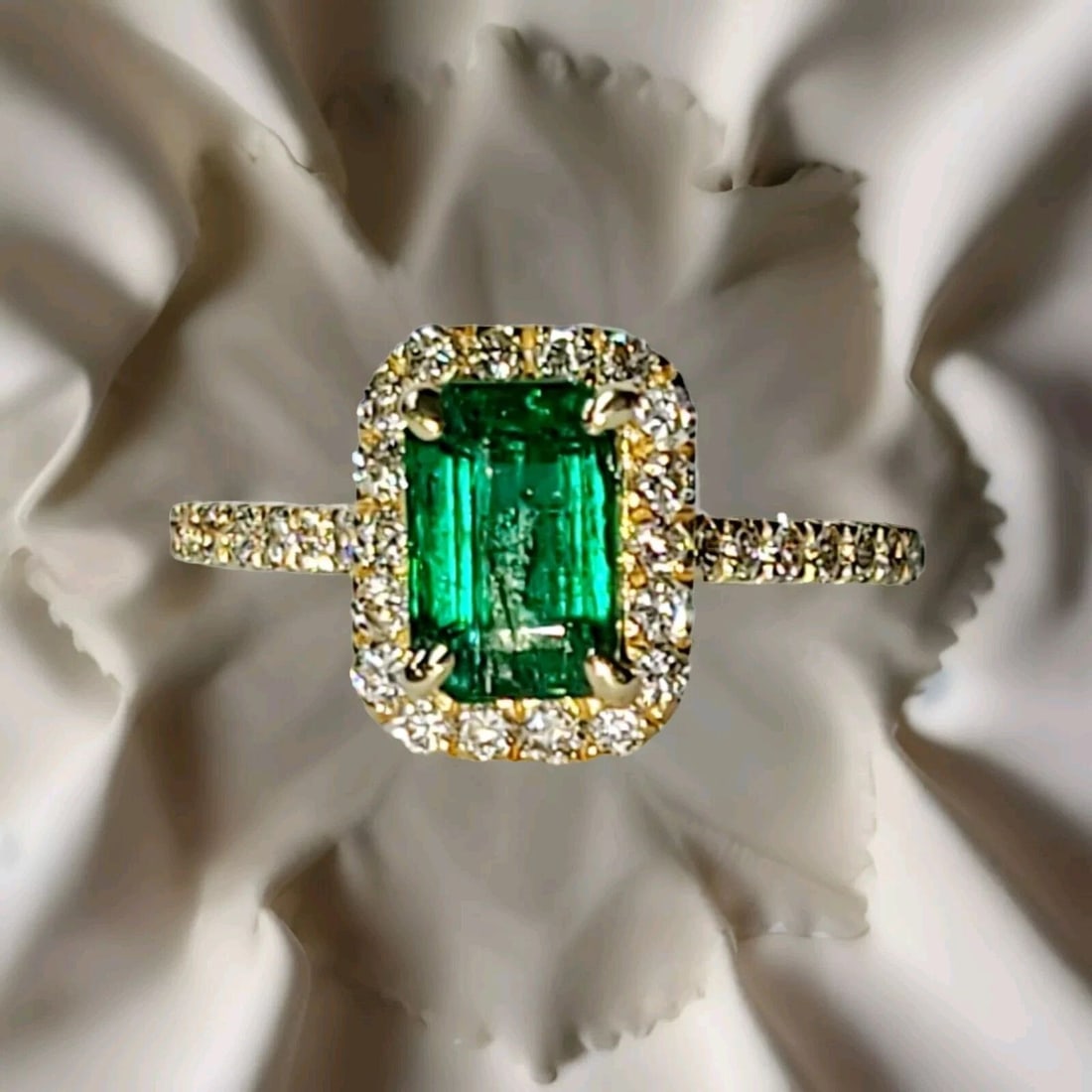 14K YELLOW ENGAGEMENT RING 1.14CT. NATURAL GREEN EMERALD RECTANGULAR SHAPE: 14K YELLOW ENGAGEMENT RING 1.14CT. NATURAL GREEN EMERALD RECTANGULAR SHAPE This stunning engagement band features a beautiful 1.14ct natural green emerald in a rectangular shape, set in a 14k yellow g