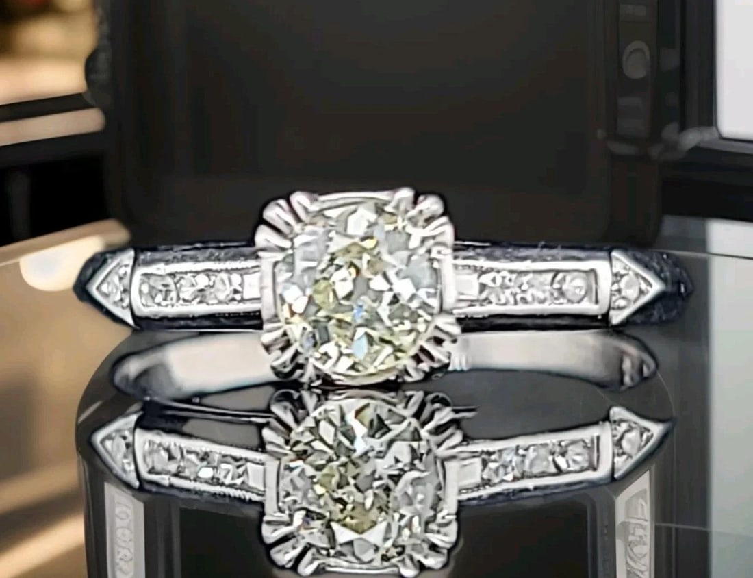 VINTAGE PLATINUM ENGAGEMENT RING 0.52CT.NATURAL EURO CUT DIAMOND CIRC 1930'S: VINTAGE PLATINUM ENGAGEMENT RING 0.52CT.NATURAL EURO CUT DIAMOND CIRC 1930'S This vintage platinum engagement ring boasts a stunning 0.52ct natural euro cut diamond, set in a solitaire with accents st