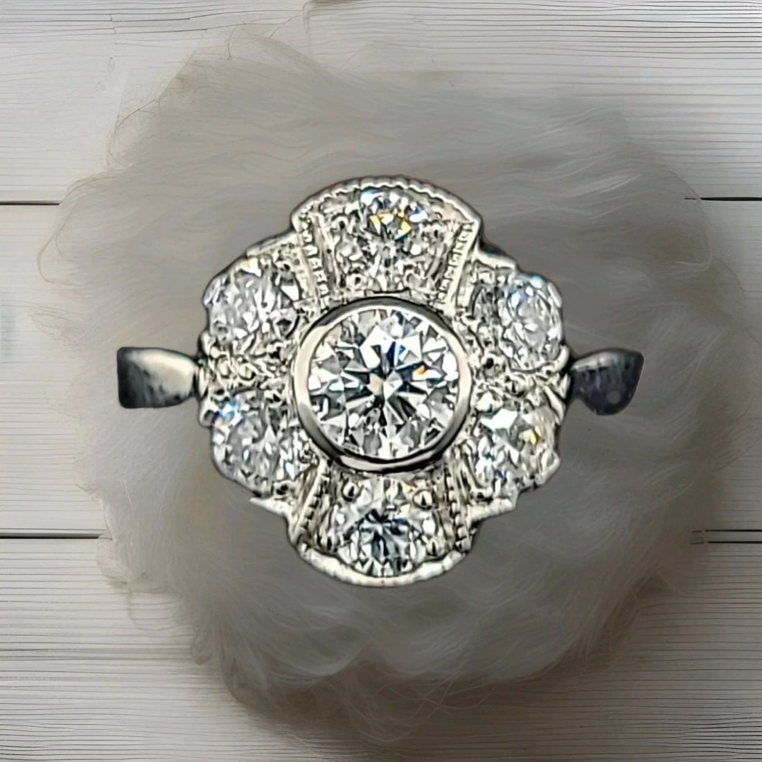 PLATINUM VINTAGE ENGAGEMENT RING 1.25CT. LAB-GROWN ROUND DIAMONDS: PLATINUM VINTAGE ENGAGEMENT RING 1.25CT. LAB-GROWN ROUND DIAMONDS This Platinum Vintage Engagement Ring features 1.25ct of lab-grown round diamonds, with a total of 7 diamonds in the setting. The ring