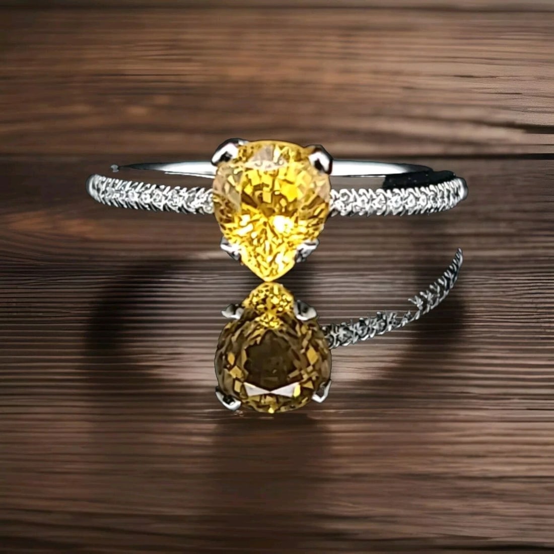 18K WHITE GOLD ENGAGEMENT RING 1.43CT. NATURAL YELLOW SAPPHIRE PEAR SHAPE: 18K WHITE GOLD ENGAGEMENT RING 1.43CT. NATURAL YELLOW SAPPHIRE PEAR SHAPE GORGEOUS 18K white GOLD natural yellow Sapphire in pear shape Center weight 1.43ct. size 8x7mm very nice rich yellow canary co