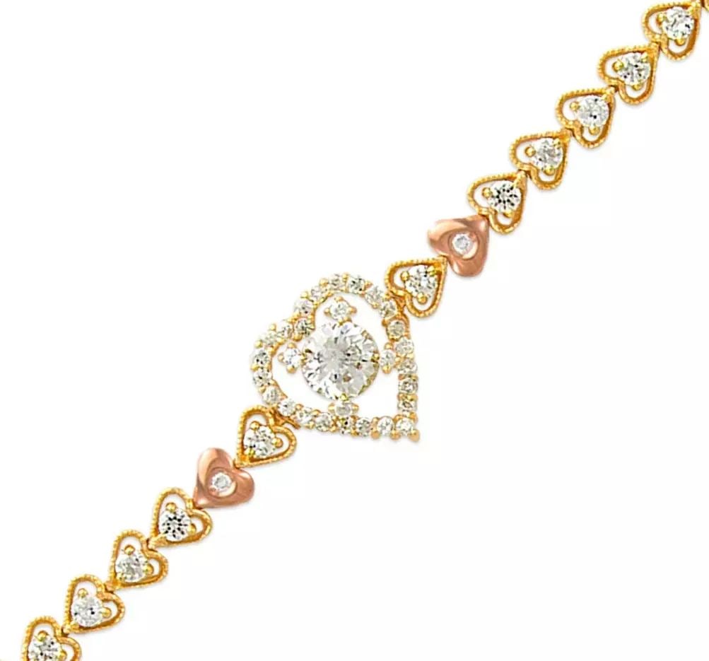 NEW 14K TWO TONE GOLD FANCY CZ BRACELET 14K Two Tone Gold Approx. 5mm Wide, 14mm Center Available in: NEW 14K TWO TONE GOLD FANCY CZ BRACELET 14K Two Tone Gold Approx. 5mm Wide, 14mm Center Available in White Gold Length : 7" Inch Weight: 12.0 Grams