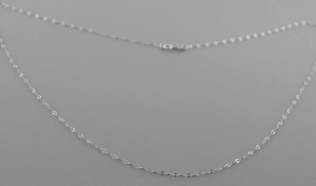 NEW 14K WHITE GOLD 16" CHAIN Please note, these chains are thin and dainty, if your pendant is more: NEW 14K WHITE GOLD 16" CHAIN Please note, these chains are thin and dainty, if your pendant is more than a couple of grams, it wont hang correctly. Necklace measures 16" Long x 0.8mm Wide 14K White go