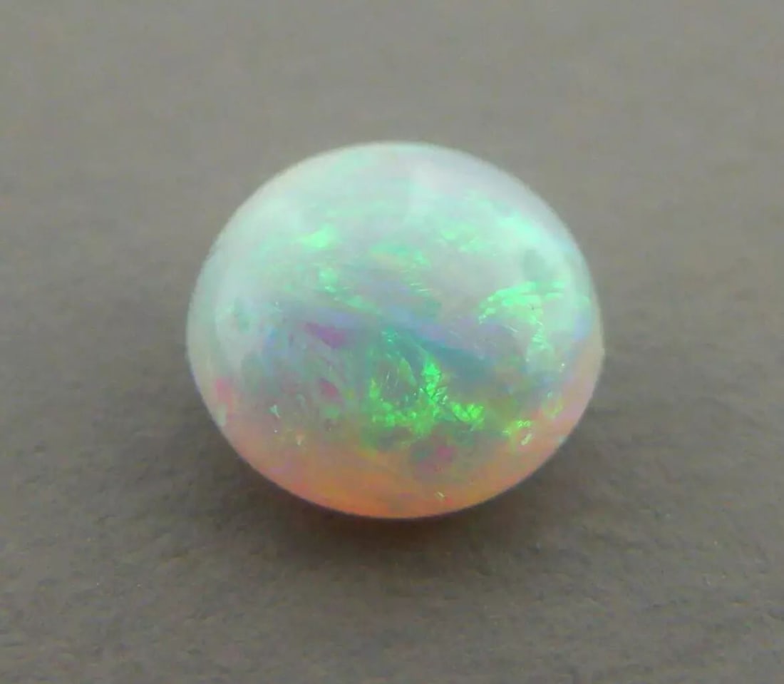 LOOSE NATURAL UNTREATED ROUND CUT CABOCHON OPAL Sale is for 1 round cut cabochon opal Opal measures (1 of 2)