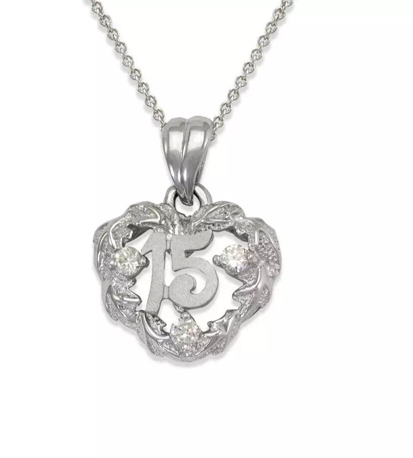 NEW 14K WHITE GOLD 15 ANOS FANCY CZ PENDANT: NEW 14K WHITE GOLD 15 ANOS FANCY CZ PENDANT 14K White Gold Approx. 15x19mm High Polished/Satin Finished/Cubic Zirconia Chains Sold Separately Items in this Set: Ring Available as a Set Weight: 2.0 Gra