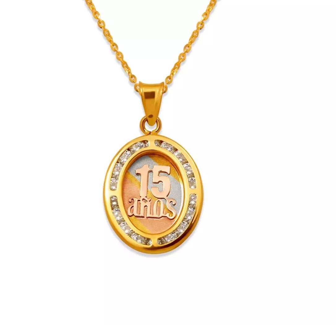 NEW 14K TRICOLOR GOLD 15 ANOS CZ PENDANT: NEW 14K TRICOLOR GOLD 15 ANOS CZ PENDANT 14K Tricolor Gold Approx. 13x16mm Cubic Zirconia Chains Sold Separately Weight: 1.0 Grams