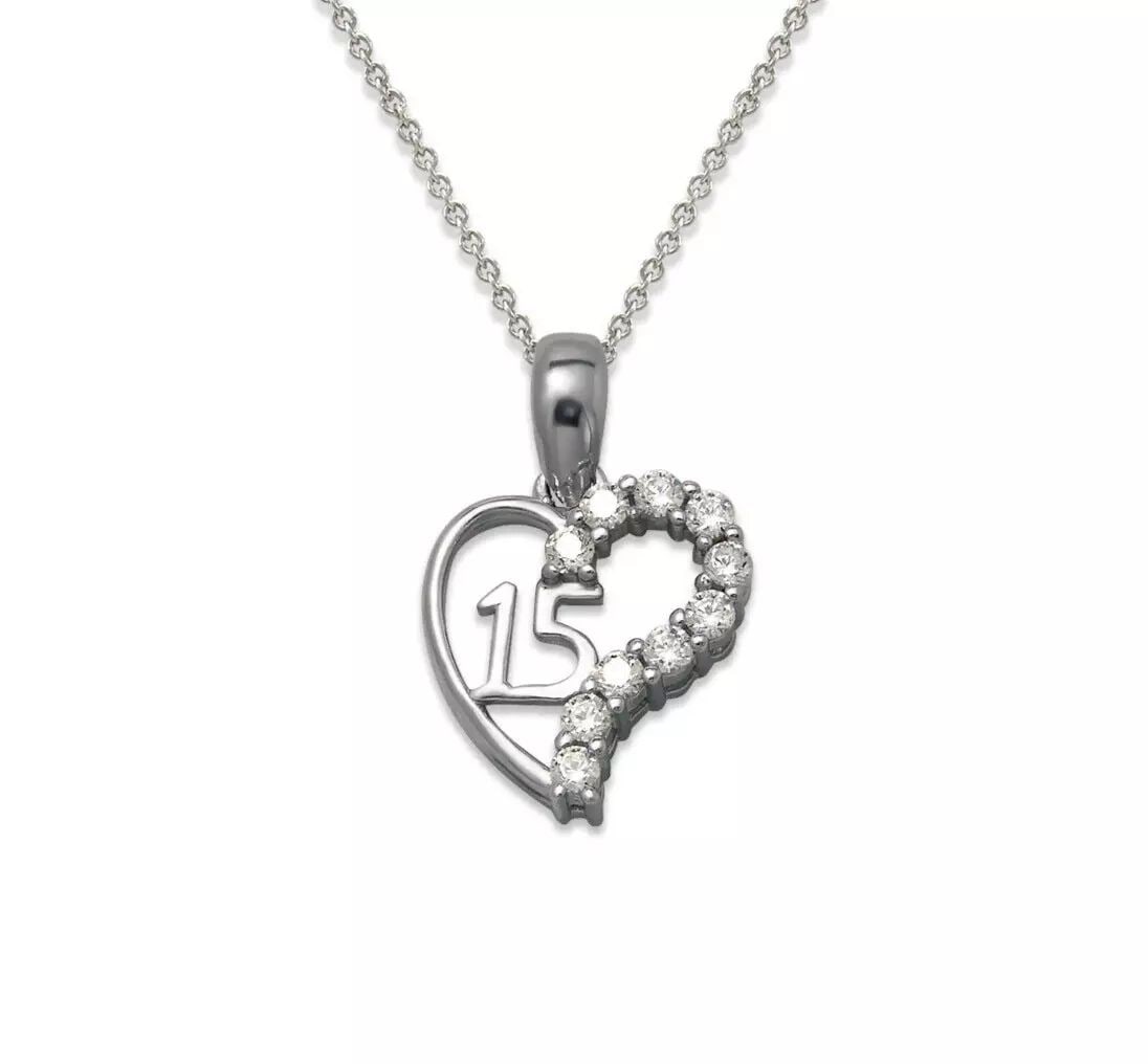 NEW 14K WHITE GOLD 15 ANOS HEART CZ PENDANT: NEW 14K WHITE GOLD 15 ANOS HEART CZ PENDANT 14K Yellow Gold Approx. 13x15mm High Polished/Cubic Zirconia Chains Sold Separately Weight: 1.3 Grams