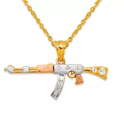 NEW 14K TRICOLOR GOLD FANCY RIFLE CZ PENDANT: NEW 14K TRICOLOR GOLD FANCY RIFLE CZ PENDANT 14K Tricolor Gold Approx. 45x15mm High Polished/Satin Finished/Cubic Zirconia Chains Sold Separately Weight: 3.5 Grams
