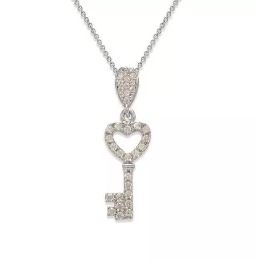 NEW 14K WHITE GOLD FANCY HEART KEY CZ PENDANT: NEW 14K WHITE GOLD FANCY HEART KEY CZ PENDANT 14K White Gold Approx. 8x19mm High Polished/Cubic Zirconia Available in Rose and Yellow Gold Chains Sold Separately Weight: 1.2 Grams