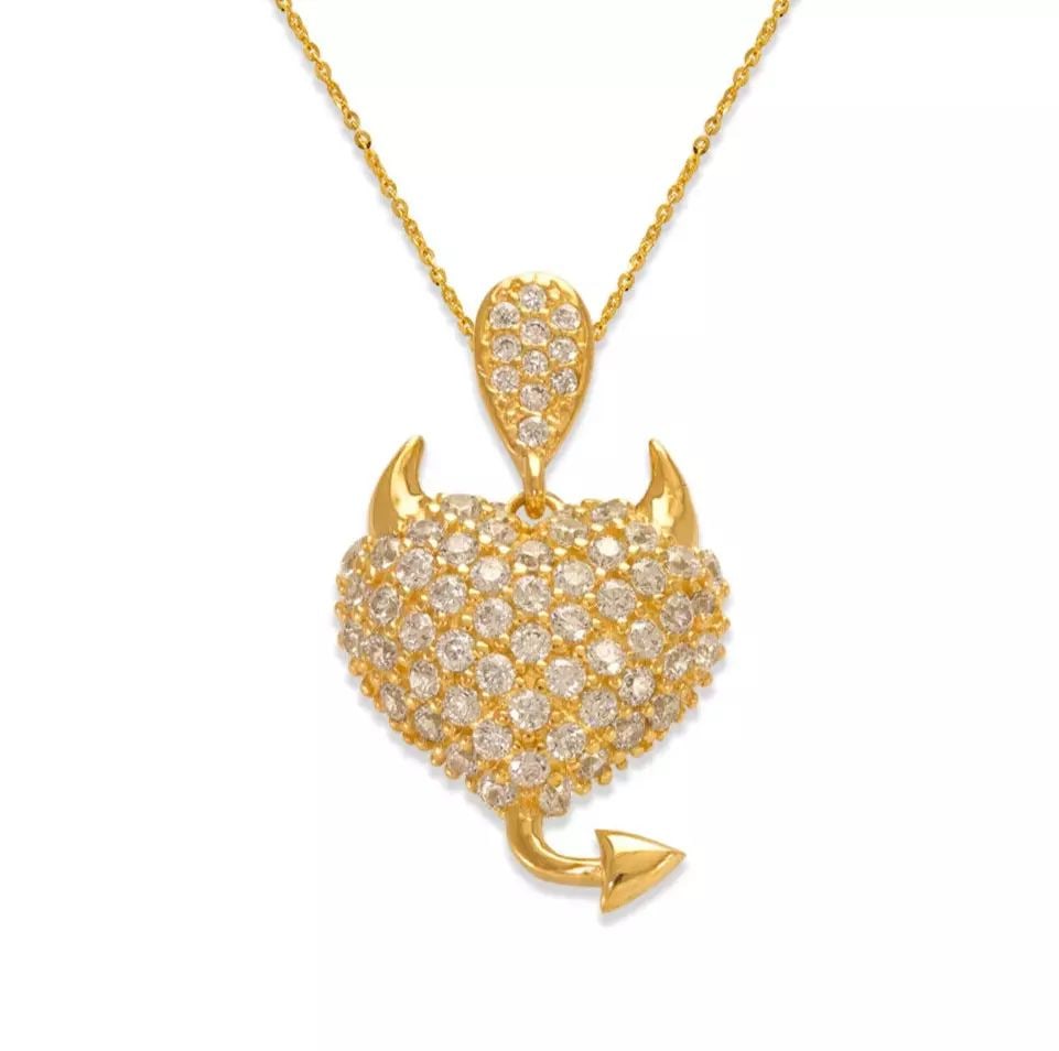 NEW 14K YELLOW GOLD FANCY DEVILISH HEART CZ PENDANT: NEW 14K YELLOW GOLD FANCY DEVILISH HEART CZ PENDANT 14K Yellow Gold Approx. 13.5x17.5mm High Polished/Cubic Zirconia Chains Sold Separately Weight: 2.2 Grams