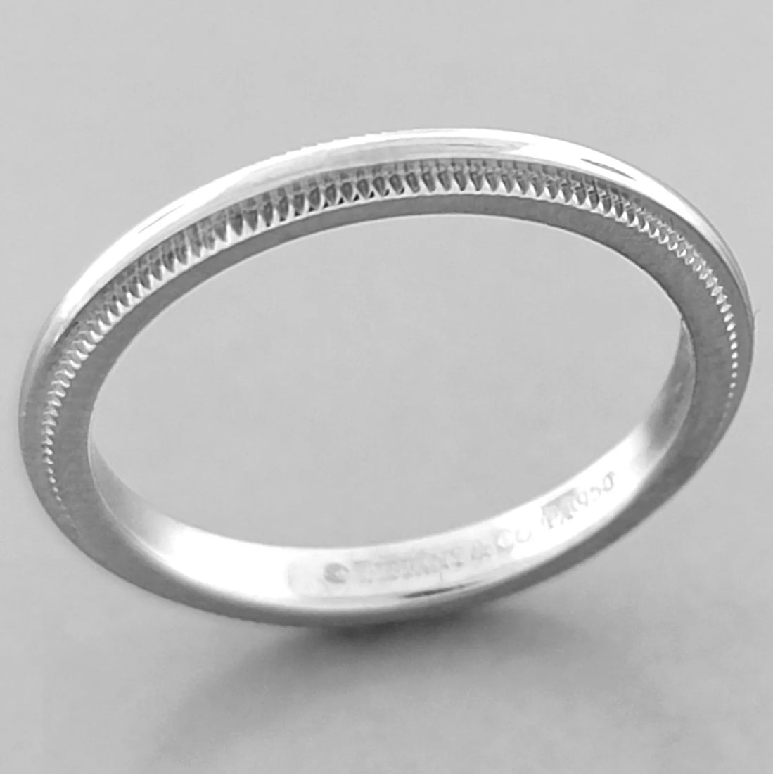 TIFFANY & Co. 2mm TOGETHER MILGRAIN PLATINUM WEDDING BAND RING SIZE 5: TIFFANY & Co. TOGETHER WEDDING BAND RING SIZE 5 Ring size is a 5 Ring measures 2mm wide 1.8mm Thick/High Tiffany & Co. Together platinum 2mm milgrain wedding band Pre-owned in Excellent condition, ple