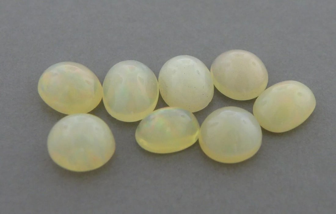 4.66ct OVAL CABOCHON LOT OF 8 LOOSE NATURAL UNTREATED OPAL: 4.66ct OVAL CABOCHON LOT OF 8 LOOSE NATURAL UNTREATED OPAL LOOSE NATURAL UNTREATED OVAL CABOCHON WHITE OPAL 4.66ct Total weight Lot of 8 opals Natural untreated White Opal New Color play, red, green a