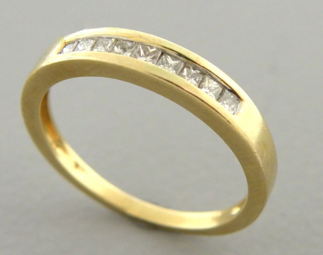 14K YELLOW GOLD LADIES DIAMOND RING WEDDING BAND PRINCESS CUT SIZE 6.75: LADIES 14K YELLOW GOLD DIAMOND WEDDING BAND RING SIZE 6.75 Ring size is a 6.75 Ring measures 3.4mm wide on top 14K Yellow gold, Princess cut diamond band 9 diamonds, 0.03ct each diamond, Total diamond