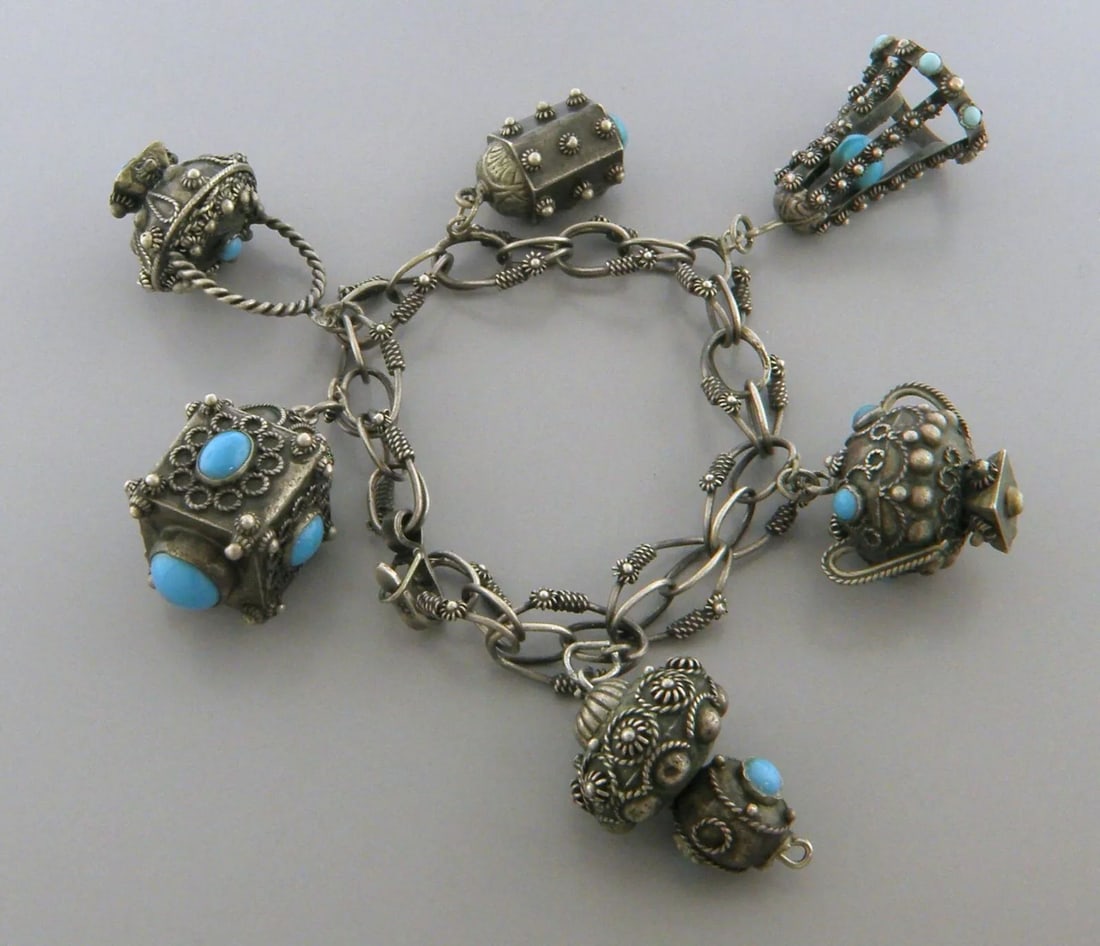 VINTAGE BEAUTIFUL LARGE 800 SILVER TURQUOISE CHARM BRACELET ETRUSCAN: TURQUOISE SILVER BRACELET Turquoise 800 silver Etruscan charm Bracelet Measures 8" Long 6 charms Vintage, Pre-owned, in good condition, minor wear due to age please refer to pics Due to age it has acq
