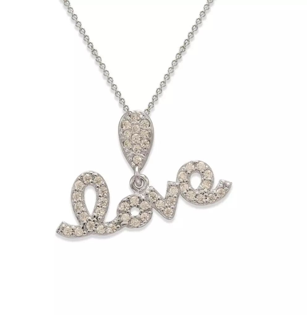 NEW 14K WHITE GOLD FANCY LOVE CZ PENDANT: NEW 14K YELLOW GOLD FANCY HEART CZ PENDANT 14K Yellow Gold Approx. 16x13mm High Polished/Cubic Zirconia Available in Rose and White Gold Chains Sold Separately Weight: 0.9 Grams