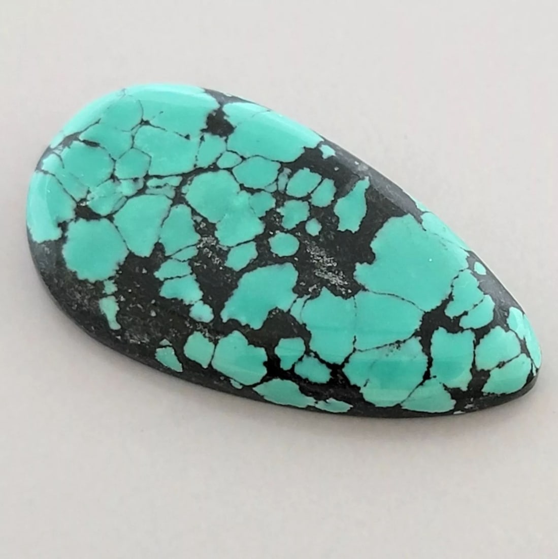 26.8ct NATURAL TURQUOISE WEB MATRIX PEAR SHAPE CABOCHON (1 of 2)
