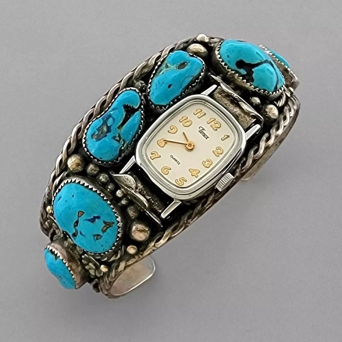 VINTAGE BEAUTIFUL NAVAJO STERLING SILVER TURQUOISE WATCH CUFF BRACELET: VINTAGE TURQUOISE STERLING SILVER WATCH CUFF Vintage Turquoise sterling silver Navajo watch cuff Timex watch, keeps accurate time Measures 2.37" inside length Measures 1.23" wide in front Vintage, Pre