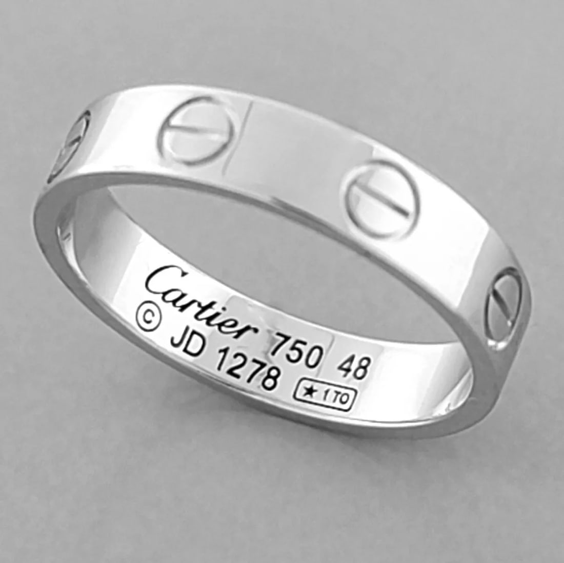 CARTIER 18K WHITE GOLD MINI WEDDING BAND LOVE RING SIZE 4.5 - 48 BOX: CARTIER 18K GOLD WEDDING BAND RING SIZE 4.5 Ring size is a 4.5 Ring measures 3.5mm wide Cartier 18K white gold mini love wedding band Pre-owned in Excellent condition, please refer to pics Cartier box