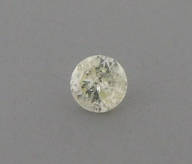 0.12ct LIGHT FANCY YELLOW DIAMOND ROUND CUT UNTREATED (1 of 2)