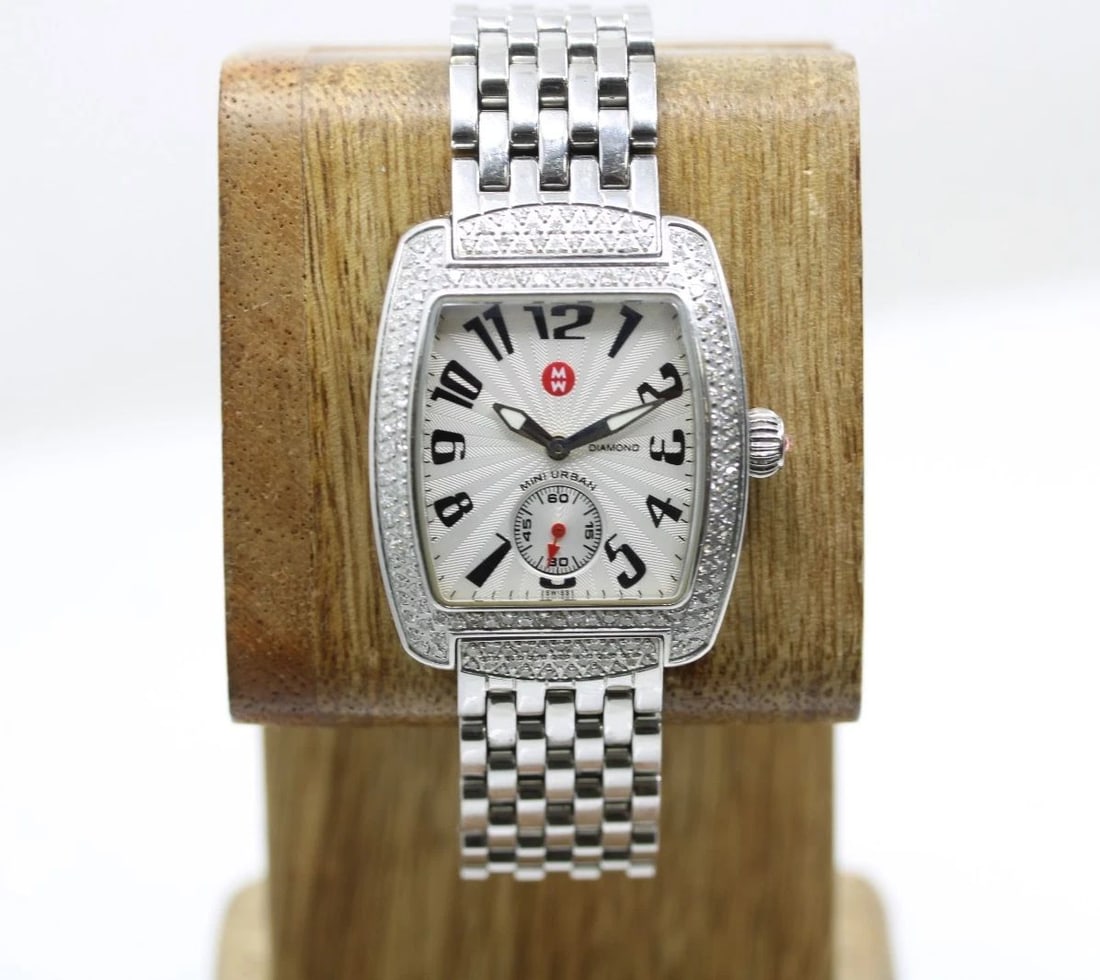 MICHELLE MINI URBAN 0.65 TCW DIAMOND WHITE RECTANGLE DIAL WATCH MW02A01A2001: MICHELLE MINI URBAN 0.65 TCW DIAMOND WHITE RECTANGLE DIAL WATCH MW02A01A2001 Description Michelle Mini Urban 0.65 TCW Diamond White Rectangle Dial Watch MW02A01A2001 The watch has been used previously
