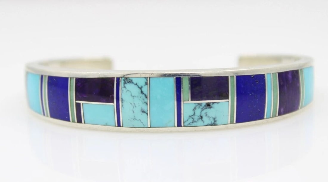 NAVAJO DAVID ROSALES SUPERSMITH SS 925 TURQUOISE & LAPIS CUFF 6.25" BRACELET: NAVAJO DAVID ROSALES SUPERSMITH SS 925 TURQUOISE & LAPIS CUFF 6.25" BRACELET Description Navajo David Rosales SuperSmith SS 925 Turquoise & Lapis Cuff Bracelet Designer bracelet in great condition. Ma
