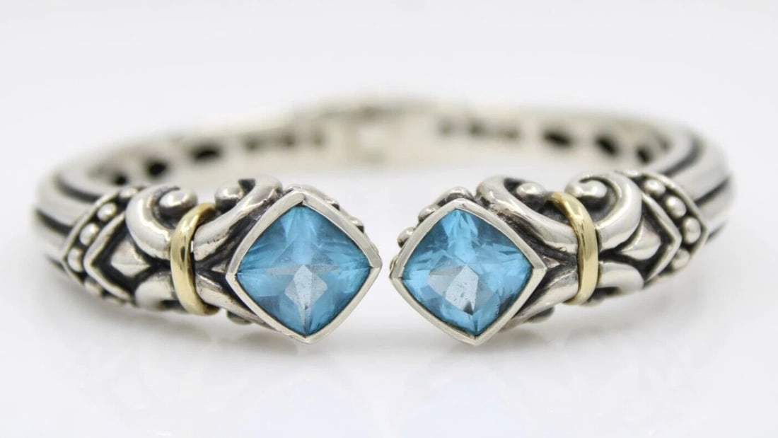 SAMUEL BENHAM BJC STERLING SILVER & 18K GOLD BLUE TOPAZ CUFF BRACELET 37.1 G: SAMUEL BENHAM BJC STERLING SILVER & 18K GOLD BLUE TOPAZ CUFF BRACELET 37.1 G SAMUEL BENHAM BJC STERLING SILVER & 18K GOLD BLUE TOPAZ CUFF BRACELET 37.1 G Description Samuel Benham BJC Sterling Silver