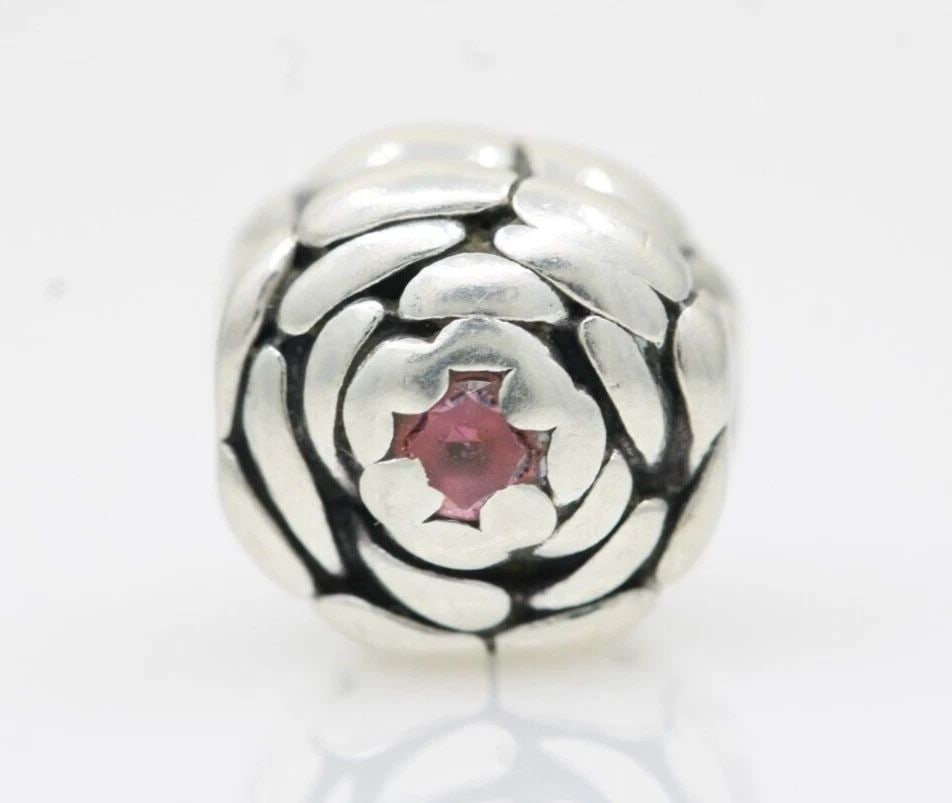 PANDORA ALE STERLING SILVER BLOOMING PINK ROSE CHARM 790575CZS: PANDORA ALE STERLING SILVER BLOOMING PINK ROSE CHARM 790575CZS Description Pandora ALE Sterling Silver Blooming Pink Rose Charm 790575CZS Pandora charm is in good condition. May show signs of wear and