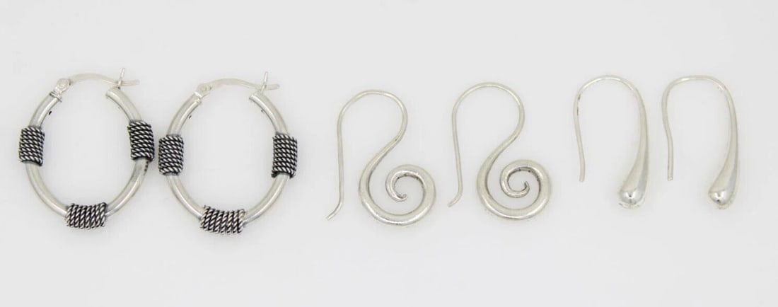 SET OF 3 STERLING SILVER DANGLE HOOP HOOK SWIRL EARRINGS - 11.5 GRAMS: SET OF 3 STERLING SILVER DANGLE HOOP HOOK SWIRL EARRINGS - 11.5 GRAMS Description Set of 3 Sterling Silver Dangle Hoop Hook Swirl Earrings Earrings are in great condition. May show signs of wear and/o