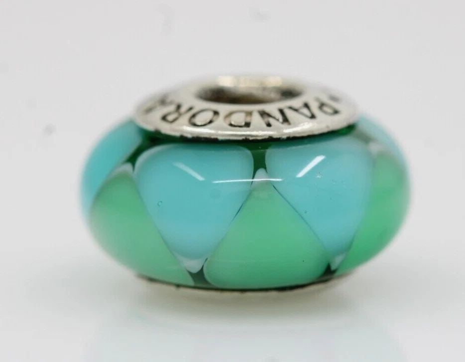 AUTHENTIC PANDORA SILVER MURANO CAPTIVATING GREEN BEAD 790636 - 3.5 GRAMS: AUTHENTIC PANDORA SILVER MURANO CAPTIVATING GREEN BEAD 790636 - 3.5 GRAMS Description Authentic Pandora Silver Murano Captivating Green Bead 790636 Pandora charm in good condition. May show signs of w