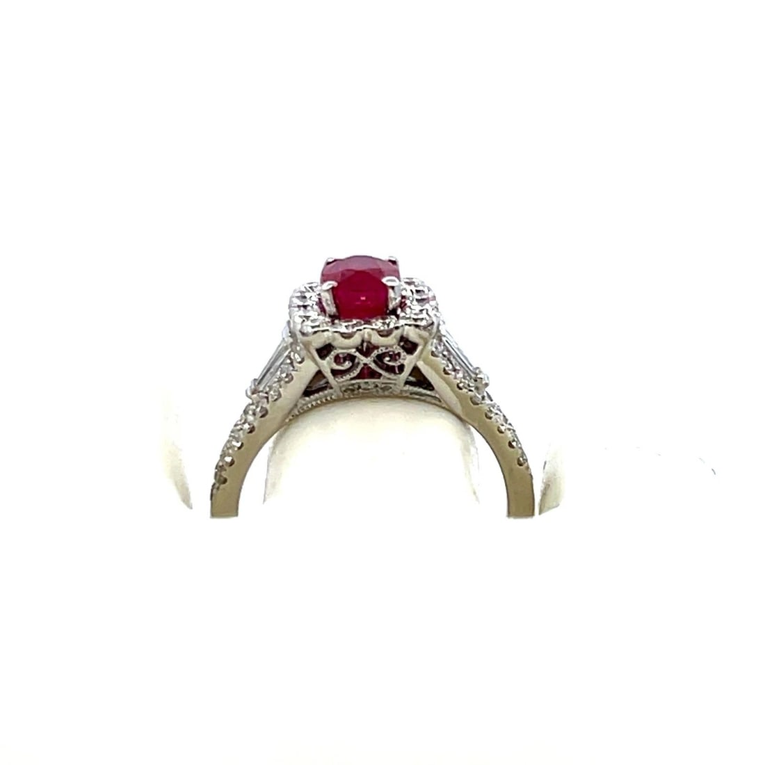 1.75 CARAT ROUND AND BAGUETTE DIAMOND 1.43 CARAT RUBY 14K WG ENGAGEMENT RING: 1.75 CARAT ROUND AND BAGUETTE DIAMOND 1.43 CARAT RUBY 14K WG ENGAGEMENT RING PRODUCT DESCRIPTION Title: 1.75 Carat Round Brilliant G VS1 and Tapered Baguette Shape G VS1 Diamond 1.43 Carat Oval Shape