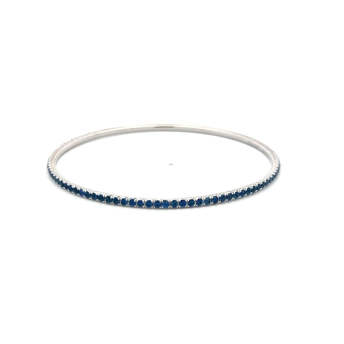 3.82 CARAT ROUND BRILLIANT SAPPHIRE 18 KARAT WHITE GOLD BANGLE BRACELET: 3.82 CARAT ROUND BRILLIANT SAPPHIRE 18 KARAT WHITE GOLD BANGLE BRACELET PRODUCT DESCRIPTION Title: 3.82 Carat Round Brilliant Sapphire 18 Karat White Gold Bangle Bracelet Style: Bangle Metal: 18 Karat