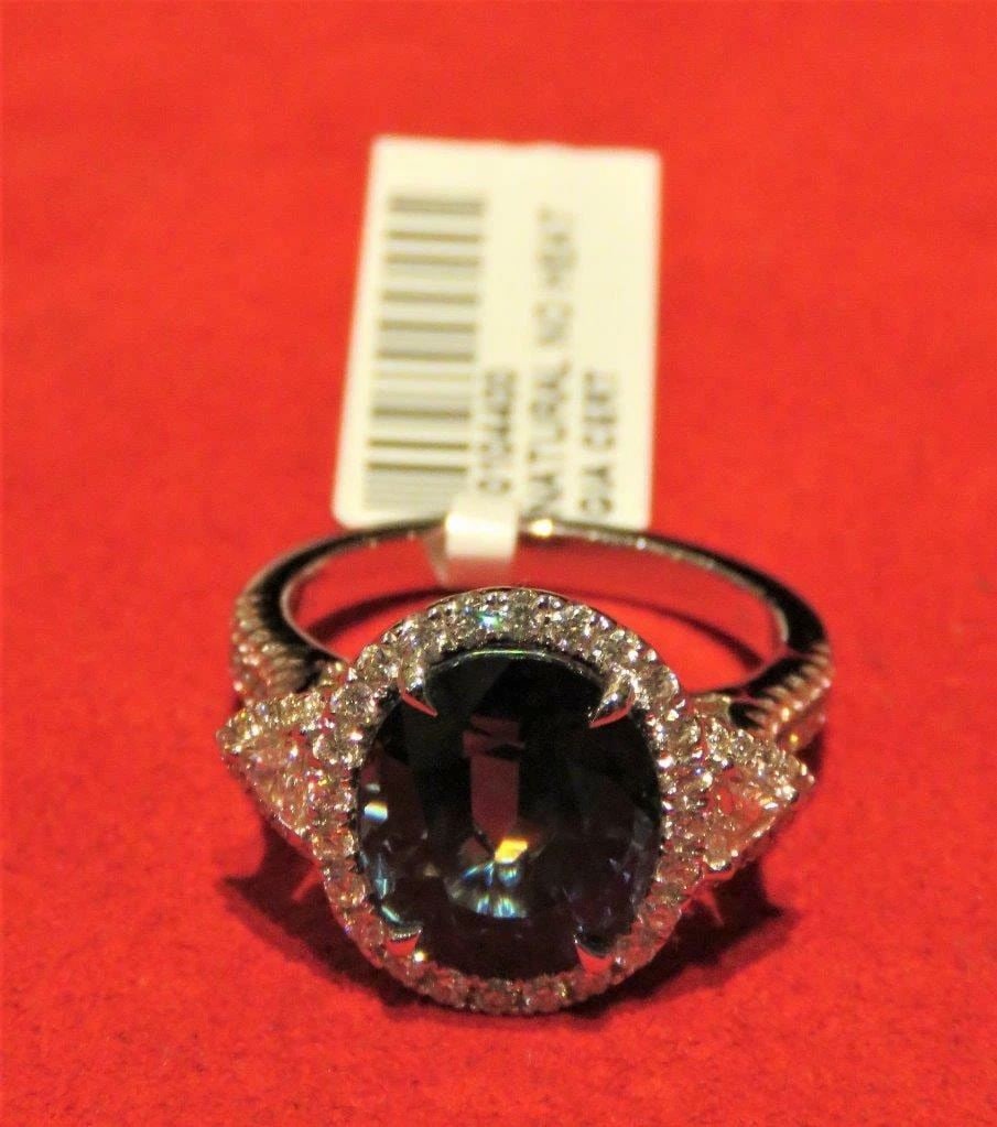 18KT GIA FANCY GORGEOUS NATURAL BLUE SAPPHIRE RING: 18KT GIA FANCY GORGEOUS NATURAL BLUE SAPPHIRE RING The Following Item we are offering is this Rare Large 18KT GOLD LARGE FANCY OVAL CUT NATURAL NO HEAT GIA CERTIFIED BLUE SAPPHIRE AND DIAMOND RING T.C