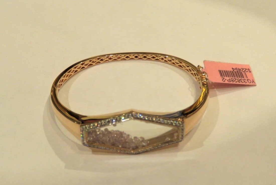 18KT GORGEOUS RARE FLOATING PINK DIAMOND BANGLE BRACELET: 18KT GORGEOUS RARE FLOATING PINK DIAMOND BANGLE BRACELET The Following Item we are offering is this Beautiful Rare Important 18KT Pink Gold Certified Fancy Floating Pink Diamond Bangle Bracelet. Bangl