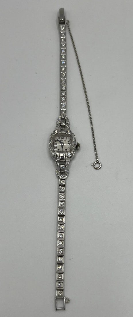 ART DECO HAMILTON LADIES DIAMOND AND PLATINUM WATCH: ART DECO HAMILTON LADIES DIAMOND AND PLATINUM WATCH Platinum and Diamond Ladies Hamilton Watch Weight is approximately 18.8 grams The watch has 34 round diamonds = approximately 1.10 ct, 34 sc diamond