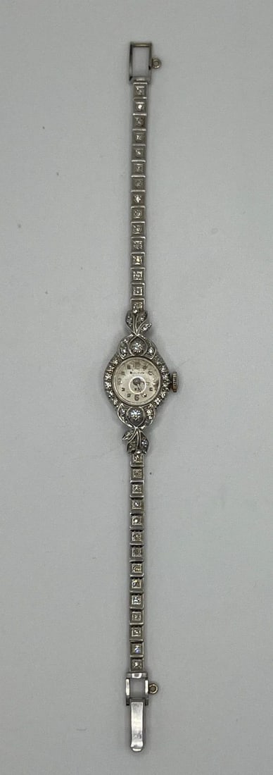 LADIES BULOVA DIAMOND WATCH: LADIES BULOVA DIAMOND WATCH 14K White Gold and Diamond Ladies Bulova Watch Watch weighs approximately 15.8 grams Has 55 sc diamonds which weigh approximately 0.60 ct The watch measures approximately 6