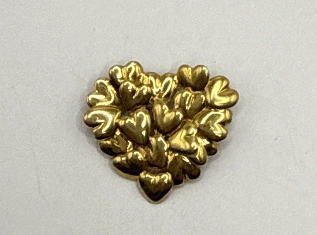 MOVADO 18K YELLOW GOLD HEART PIN/BROOCH: MOVADO 18K YELLOW GOLD HEART PIN/BROOCH Elevate your accessory collection with the Movado 18K Yellow Gold Heart Pin/Brooch, a timeless piece that seamlessly marries luxury with elegance. Crafted from
