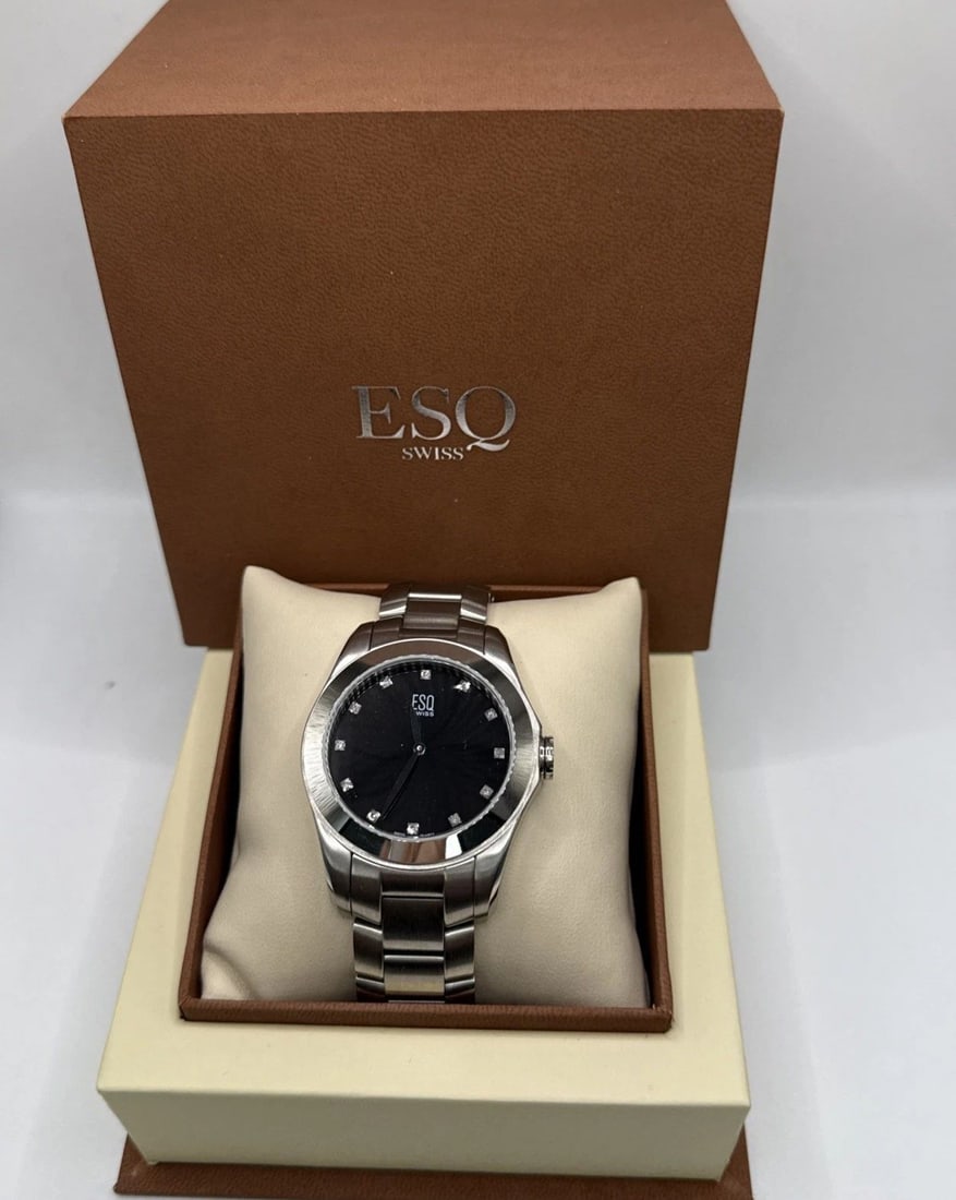 ESQ BY MOVADO E5458 ASTON STAINLESS STEEL DAIMOND BLACK DIAL MEN'S WATCH: ESQ BY MOVADO E5458 ASTON STAINLESS STEEL DAIMOND BLACK DIAL MEN'S WATCH The ESQ by Movado E5458 Aston Stainless Steel Diamond Black Dial Men's Watch is a modern quartz wristwatch with a luxurious sta