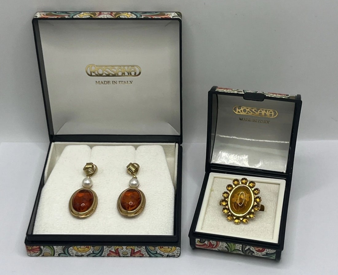 ROSSANA ITALY ENGRAVED AMBER SET - INCLUDES RING SIZE 9 & DROP EARRINGS: ROSSANA ITALY ENGRAVED AMBER SET - INCLUDES RING SIZE 9 & DROP EARRINGS This Rossana Italy jewelry set includes an engraved amber ring in size 9 and a pair of drop earrings, all exquisitely crafted in