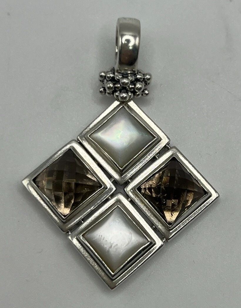 MICHAEL DAWKINS 925 STERLING SILVER MOP SMOKY QUARTZ PENDANT ENHANCER, L 1.75: MICHAEL DAWKINS 925 STERLING SILVER MOP SMOKY QUARTZ PENDANT ENHANCER, L 1.75” Enhance your jewelry collection with this stunning Michael Dawkins 925 Sterling Silver MOP Smoky Quartz Pendant Enh