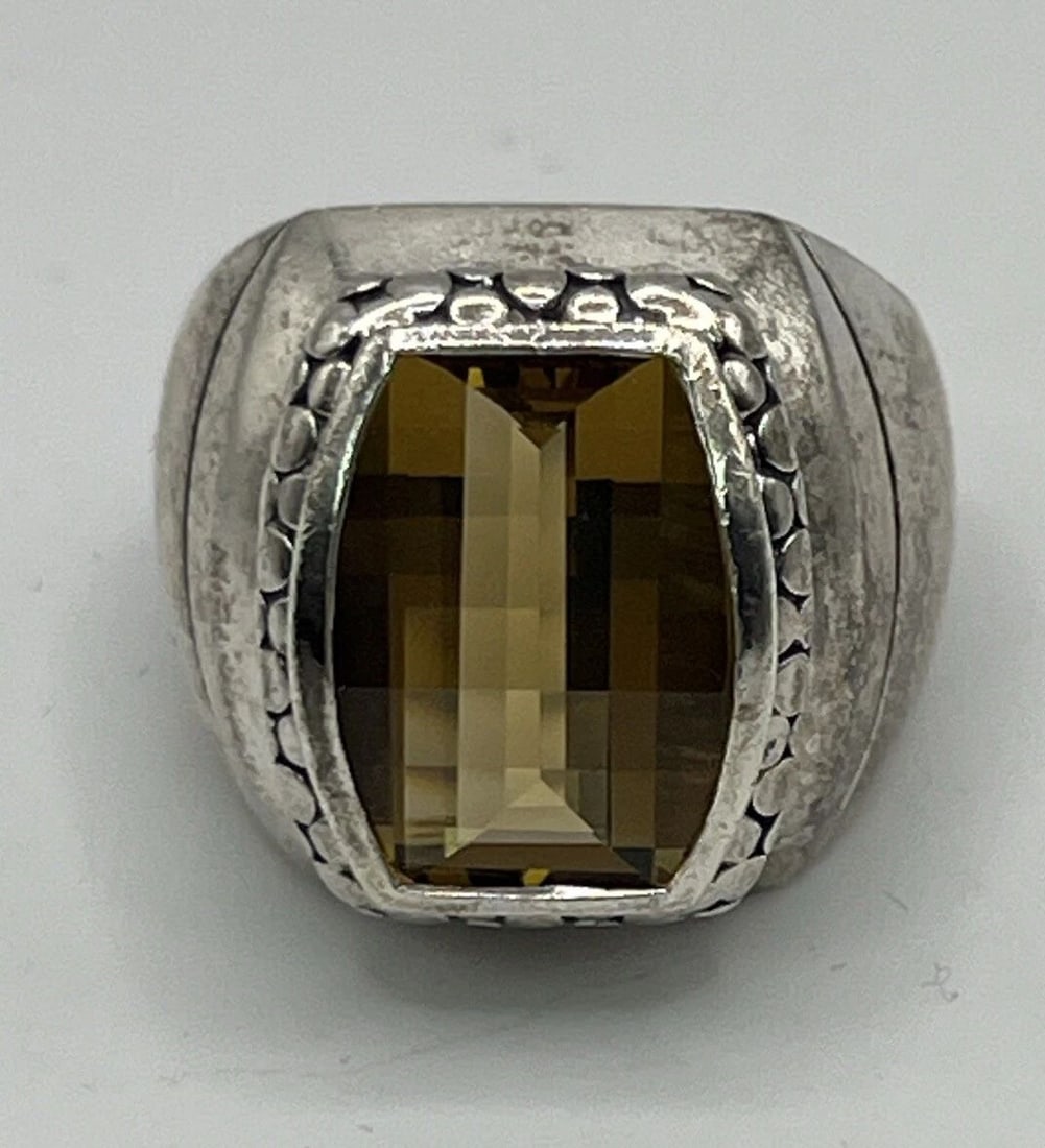 MICHAEL DAWKINS CITRINE COCKTAIL RING SIZE 7: MICHAEL DAWKINS CITRINE COCKTAIL RING SIZE 7 This beautiful cocktail ring from Michael Dawkins is the perfect addition to any jewelry collection. Crafted from high-quality sterling silver with a stunn