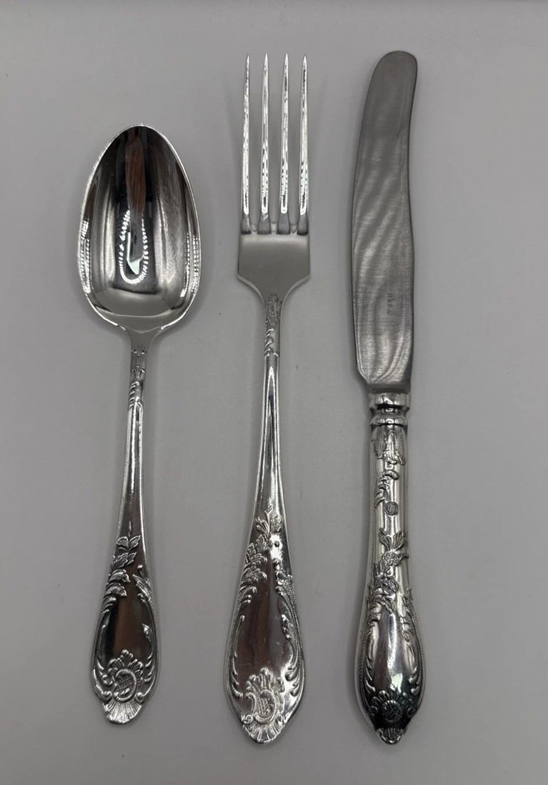 ELEGANT GERMAN SILVERWARE SET: ELEGANT GERMAN SILVERWARE SET This elegant German silverware set features a classic Victorian style design, with a Century pattern and a composition of German silver, nickel silver, and Maillechort. D
